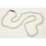 A single row graduated cultured pearl necklace, with 9ct gold bow clasp