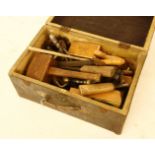 A large collection of woodworking tools, mallet, planes, etc