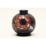 A Moorcroft Pansy pattern bulbous vase, 11cm high