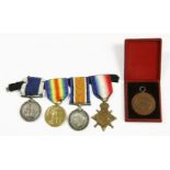 A group of WWI medals, consisting of 14/15 star, 14/18 medal, a 14/19 medal, and a 'for long service