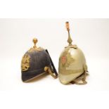 A post 1902 Royal Artillery officers helmet, with brass mounts and chin chain, together with a