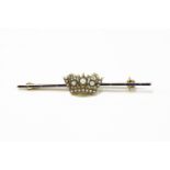 A Victorian gold naval crown bar brooch, set with pearl to crown, blue enamel to bar marked 15ct2.