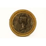 A circular relief decorated plaque of a gentleman in a gilt frame,70 cm diameter