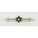 A Victorian gold enamel bar brooch, a cultured pearl set to a black enamel flower with white