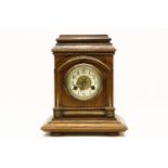 A German walnut mantel clock, 34cm high