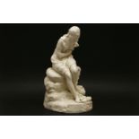 A Victorian parian figure of a young lady, seated on a tree stump, restored, 30.5cm high