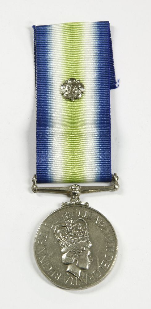 An Elizabeth II Falklands War South Atlantic Medal with rosette, named to 24453296, LCPL, A. Wild,