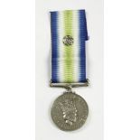 An Elizabeth II Falklands War South Atlantic Medal with rosette, named to 24453296, LCPL, A. Wild,