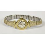A ladies Bucherer mechanical watch head, with silver dial, baton numerals and diamond cut bezel,