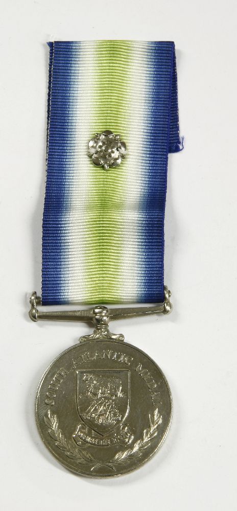 An Elizabeth II Falklands War South Atlantic Medal with rosette, named to 24453296, LCPL, A. Wild, - Image 2 of 2