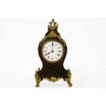 A tortoiseshell and brass inlaid boulle mantle clock, 29.5cm high