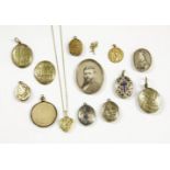 A collection of lockets, to include a gold back and front oval locket, with blue and white enamel