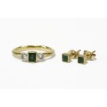 An 18ct gold emerald and diamond three stone ring, and a pair of rub set square cut emerald