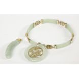 A 9ct gold jade panel bracelet with Chinese character links, a 9ct gold jade bi pendant set with a