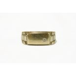 A 9ct gold gentleman's rectangular head signet ring, with Rolex link style shoulders, a brilliant