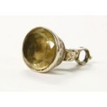 A gold cased oval faceted citrine seal, engraved decoration