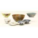 A collection of Chinese ceramics, comprising: a famille rose bowl, with flowers, against a yellow