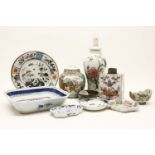 A collection of Chinese porcelain, ginger jars and covers, a teapot on stand, dishes, a damaged