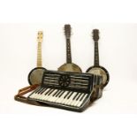 Three various banjolele, in cases, together with Lombardi piano accordion