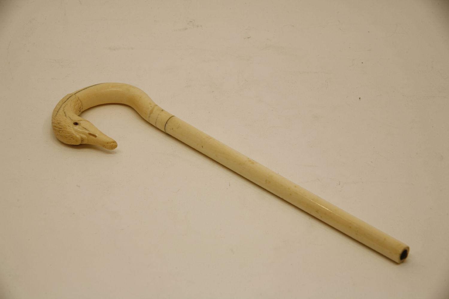 An early 20th century carved ivory swan's head parasol handle