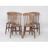A set of four late 19th century chairs lathe back beechwood kitchen chairs with solid elm seats on
