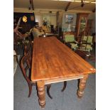 A large pine kitchen table, with three frieze drawers, 297cm long, 100cm wide, 80cm high