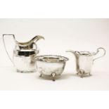 A George III style cream jug, Chester 1905, 11.5cm and another Birmingham 1920, approximately, 6 oz