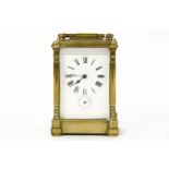 A French brass cased carriage timepiece, with alarm dial, the alarm sounded on a bell under.