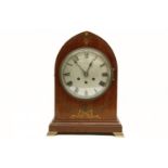 A German inlaid mahogany 'lancet' case bracket clock, three train movement, chiming the quarter