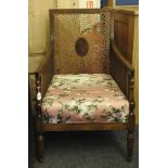 A 20th century bergere style mahogany armchair, with rattan can panels, some damage