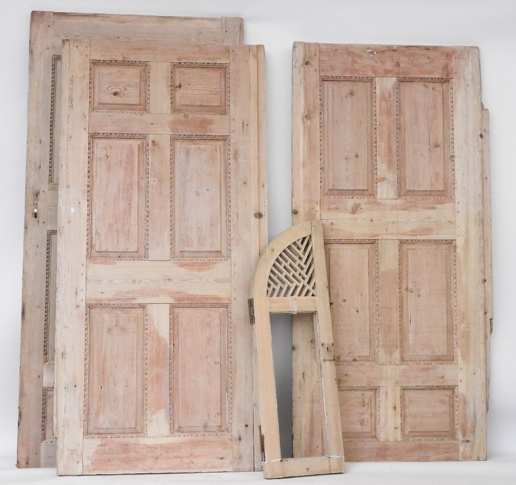 Three large stripped pine panels, with egg and dart moulding, the largest 246 x 140cm, together with