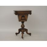 A Victorian rosewood sewing table, with Gothic blind fret work to the frieze and on a tripartite