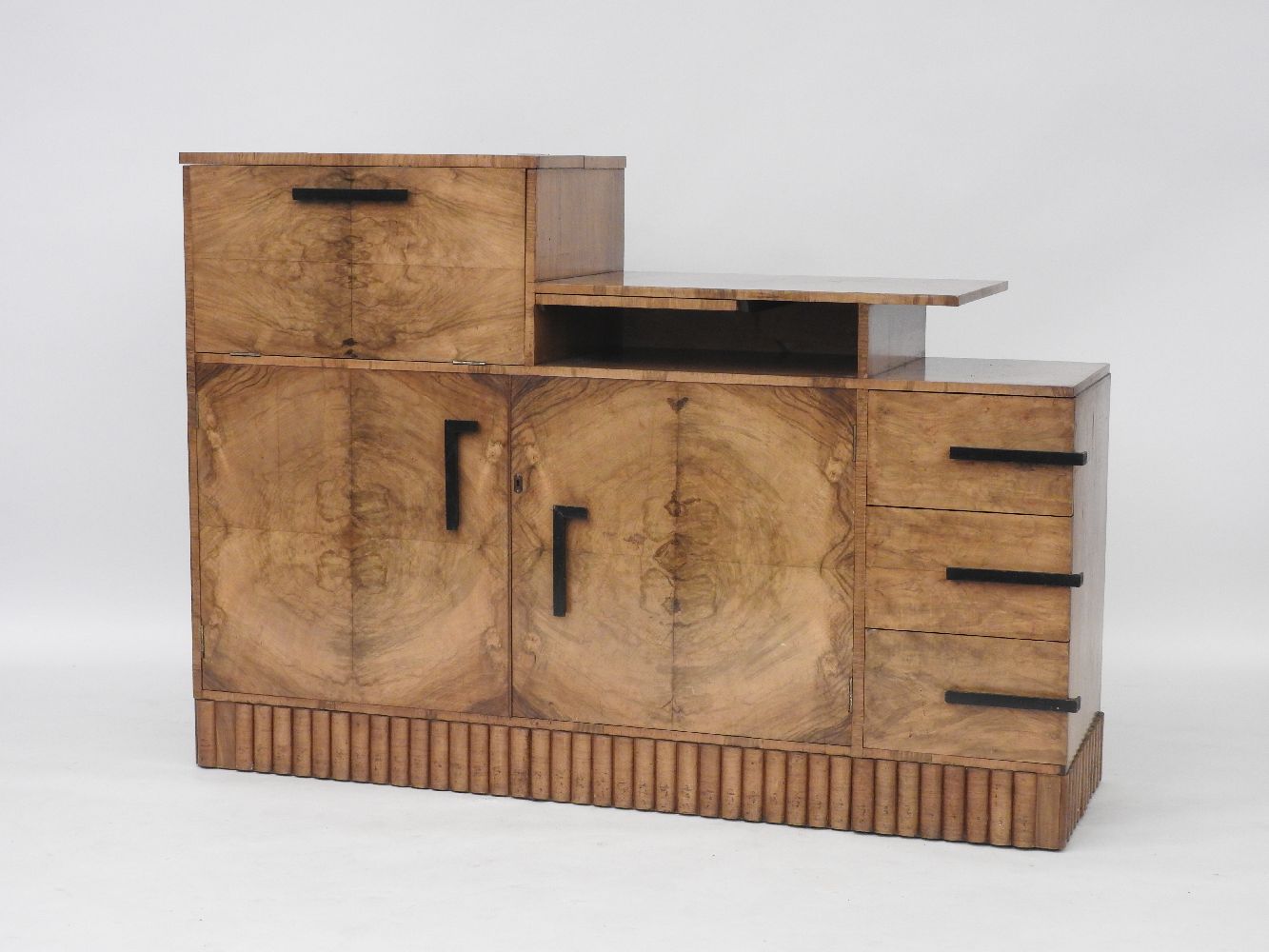 An Art Deco walnut dining room suite, comprising a table with two extra leaves, 156cm long x 93cm