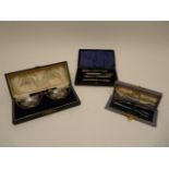 A pair of silver boat shaped salts with spoons, cased, a pair of forks, cased and a manicure set