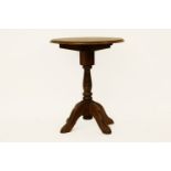 A modern oak occasional table, with anthemion decoration, 60cm diameter