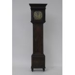 An early 19th century oak cased 30 hour long case clock, the square brass dial inscribed John Smith,