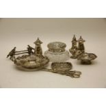 A silver topped dressing table box, together with a pair of silver plated knife rests, surmounted by