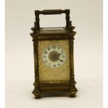 A French brass carriage clock, marked 'R & Co, Made in Paris'.16cm high