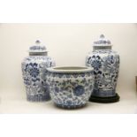 A pair of Chinese blue and white vases and covers, and a Chinese blue and white fish bowl