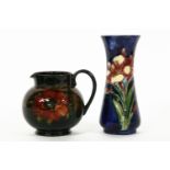 Two Moorcroft items: a vase, 18cm, and a jug, 11cm. (jug restored)