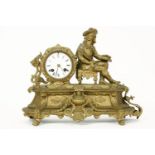 A French gilt mantel clock, the enamel dial with black roman numerals, the case with seated