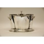 A contemporary twin handled silver plated two bottle wine cooler, a plain polished finish on oval