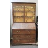 A George III mahogany bureau bookcase, with glazed top, 111cm wide x 194cm high