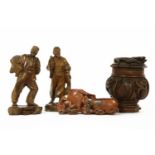 Two Chinese figures of fisherman, 20.5cm high and a carved pot and cover with dragons, 17cm high and