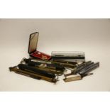 A Carrs silver Concorde luggage tag, together with a collection of commemorative Parker pens,