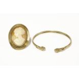 A 9ct gold torque bangle with sphere finials, and a 9ct gold shell cameo brooch/pendantbangle 5.