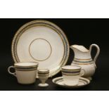 A Victorian porcelain part dinner and tea service, decorated with a gilt design and teal enamel