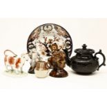 A collection of mixed ceramics including a pair of Derby blanc-de-chine figures, a silver mounted