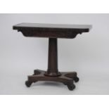 A 19th century mahogany fold over card table, on turned support, on platform base, and scroll