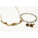 A 9ct gold necklace with two colour gold rose centrepiece, each set with a garnet, and a pair of